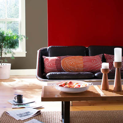 Modern style furniture in a red room.